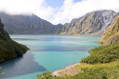 Travelers enjoy the hike to Mt. Pinatubo’s crater lake and swim on its crystal blue waters